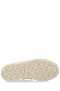Cream-colored rubber sole with hexagonal tread and salomon logo on veja unisex sneaker campo white