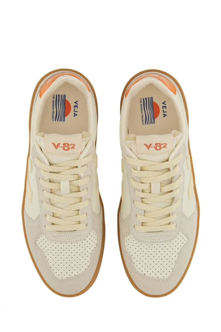 Cream-colored Veja unisex sneaker v-eja v-82 with perforated toe panels and orange accents on the heel tab