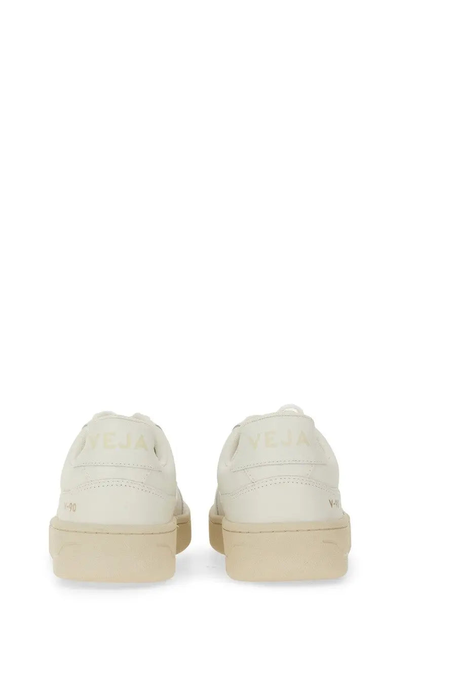Cream-colored leather Veja unisex sneakers with minimalist design and subtle branding on the heel back side