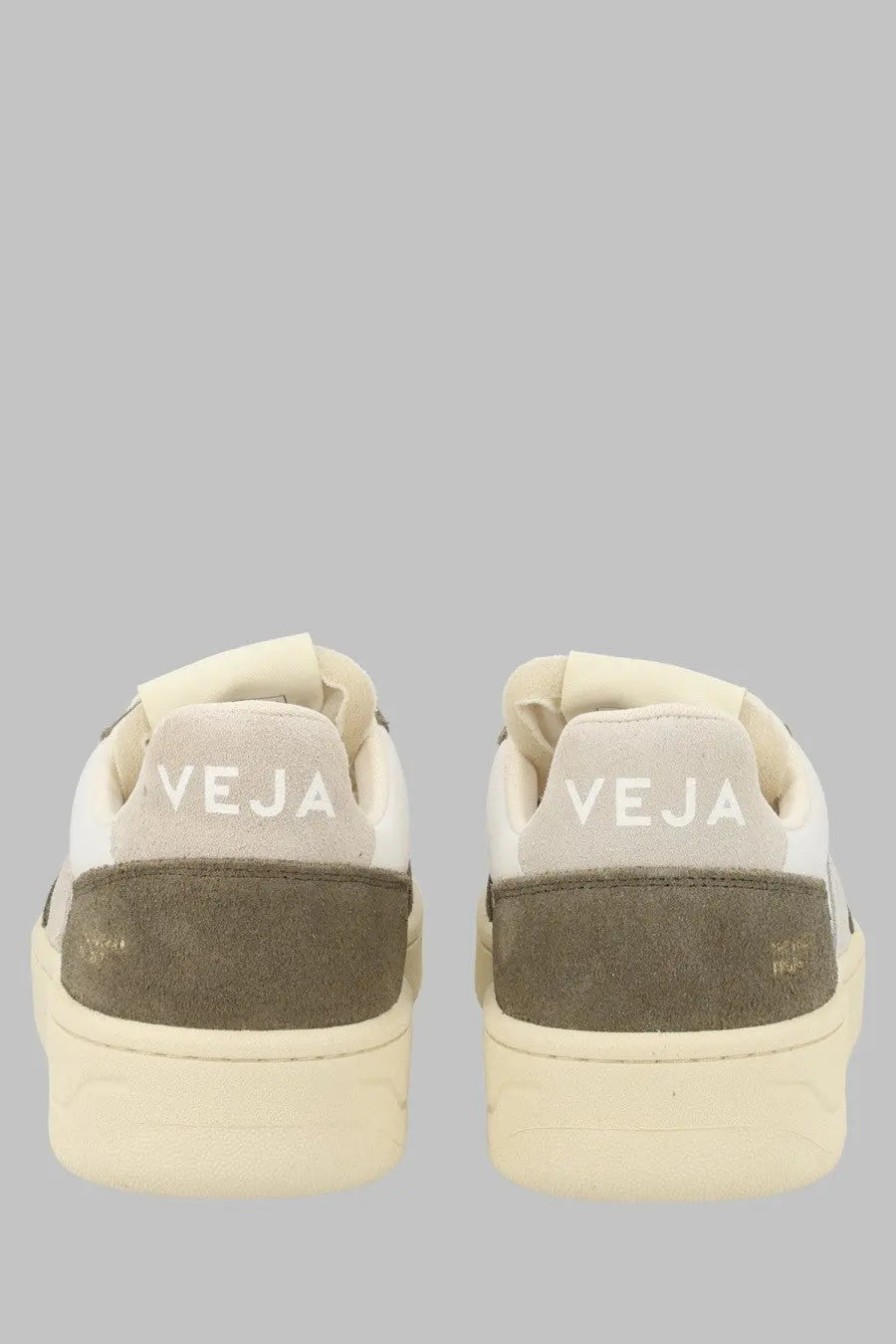 Back view of cream and olive green suede veja unisex sneaker with white stitching and veja branding on the heel