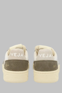 Back view of cream and olive green suede veja unisex sneaker with white stitching and veja branding on the heel