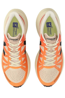 Veja women’s condor advanced sneaker in bright orange and cream with black accents designed for running