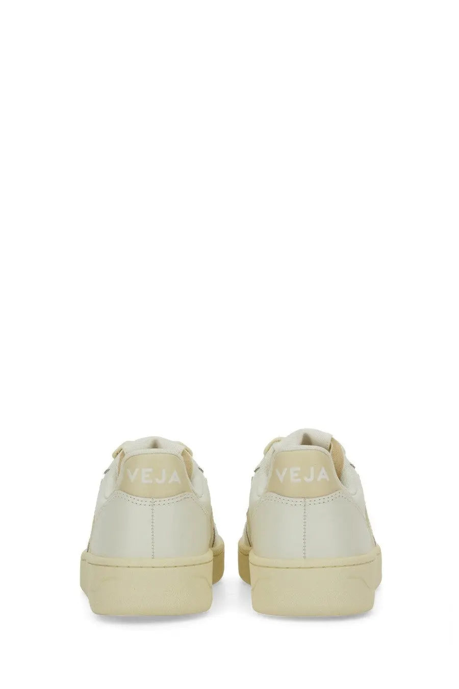Back side view of veja women’s sneaker beige cream-colored vegan leather minimalist design embossed heel
