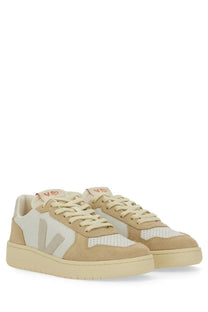 Veja women’s sneaker beige low-top with beige and white suede and mesh featuring a minimalist design