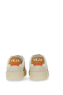 Veja women’s sneaker multicolor cream colored with orange accents and white branding on the heel back view