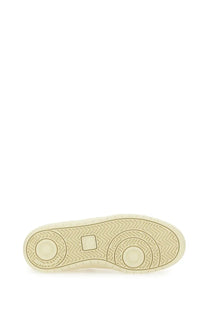 Veja women’s sneaker white with cream-colored rubber sole featuring herringbone and circular tread patterns