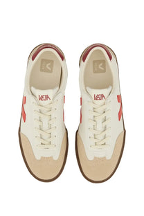 Veja women’s volley sneaker in white and beige with red accents on laces heel tab and side stripes