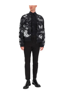 Versace Jeans Couture men’s black cotton fleece bomber jacket with intricate white floral and skull patterns and logo on chest