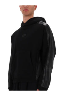 Versace Jeans Couture men’s black hoodie with glossy black leather sleeves and small rectangular logo patch on chest