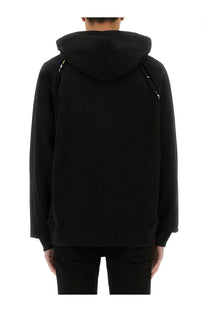 Versace Jeans Couture men’s black hoodie with subtle yellow zipper pulls along the shoulder seams
