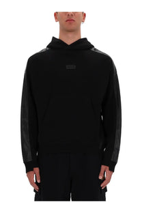 Versace Jeans Couture men’s black hoodie with matte black mesh sleeve panels and small rectangular logo patch on chest