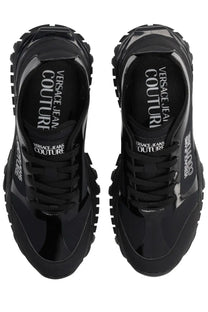 Versace Jeans Couture men’s black glossy sneakers with chunky rubber soles and reflective branding