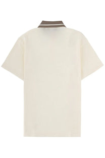 Cream-colored Versace Jeans Couture men’s polo shirt with short sleeves and brown and white striped collar