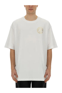 White oversized crewneck t-shirt with subtle gold circular logo on left chest from versace jeans couture mens shirt white