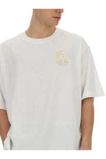 Versace jeans couture men’s white oversized t-shirt with a gold circular logo on the chest