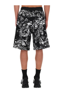 Versace jeans couture men’s black shorts with intricate silver and white porcelain baroque floral pattern