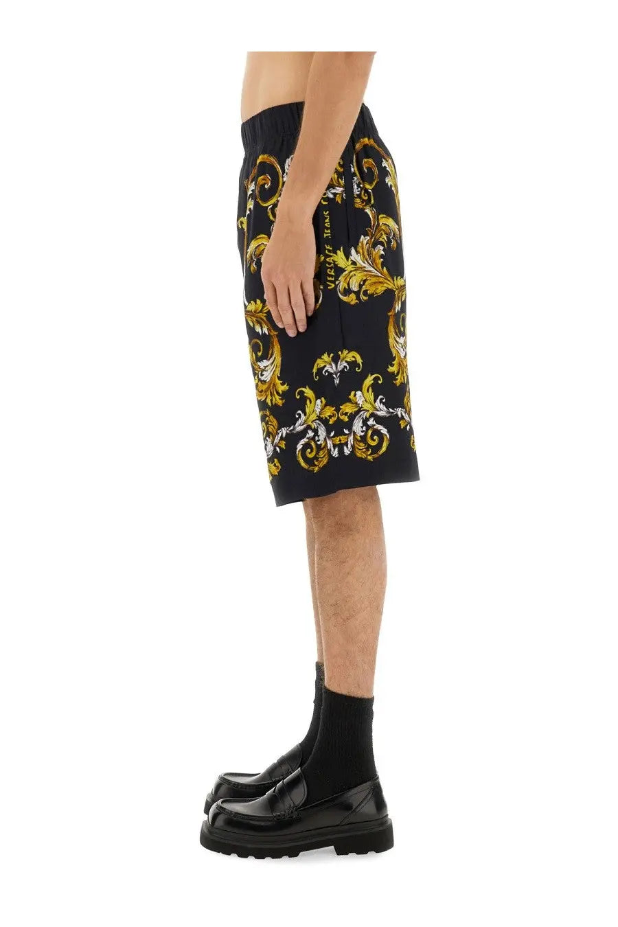 Versace jeans couture men’s black shorts with bold gold and white baroque pattern and embroidered logo on side seam