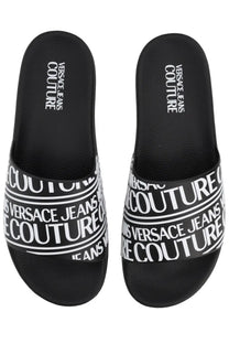 Versace jeans couture men’s slides in black with bold white repeating logo bands and a comfortable slip-on design