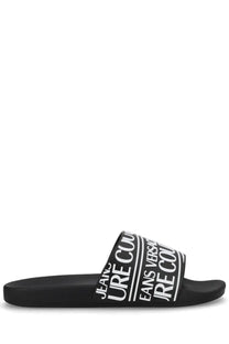 Versace Jeans Couture men’s black slide sandal with bold white branding across the strap in leather material