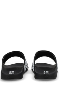 Versace jeans couture men’s black slide sandals with bold white graphic pattern and branding on the heel back side