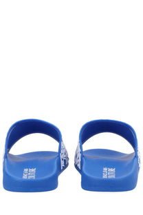 Versace Jeans Couture men’s bright blue rubber slide sandals with white logo detailing on sides and heel