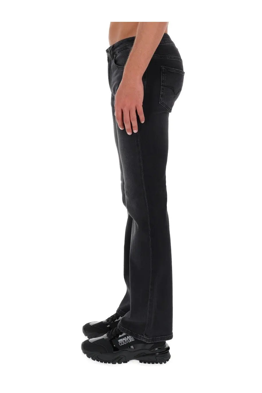 Versace jeans couture men’s black denim jeans with a slim fit and flared leg featuring subtle fading details