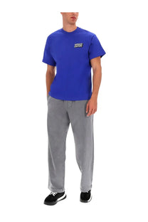 Versace jeans couture men’s blue vibrant short-sleeved t-shirt with black logo patch on the chest