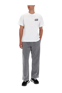 Versace Jeans Couture men’s white cotton short-sleeved t-shirt with black logo patch on left chest