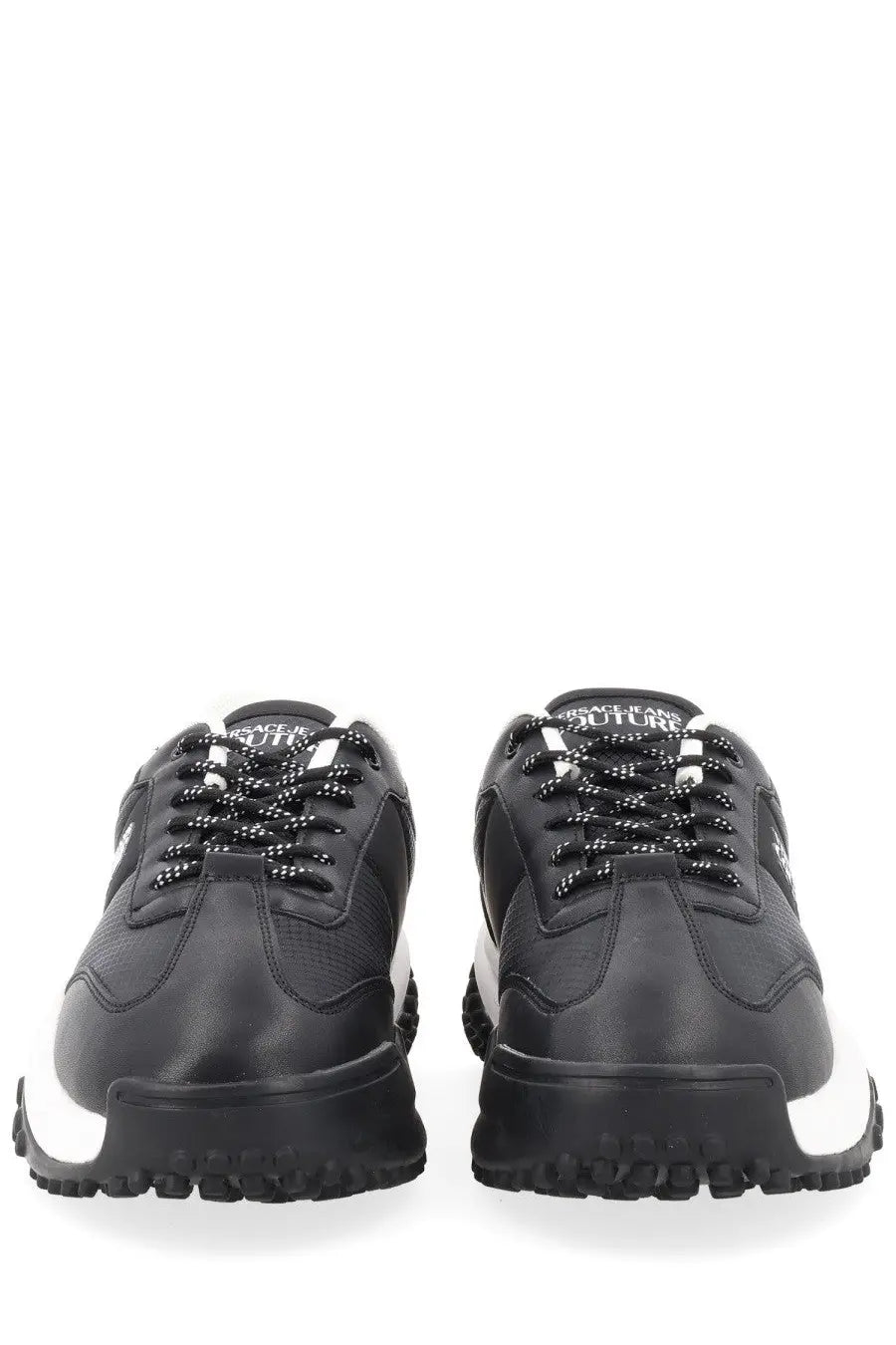 Versace Jeans Couture men’s sneaker con black featuring black and white leather upper with bold rubber sole and contrasting laces