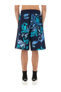 Navy blue versace jeans couture men’s sports shorts with vibrant teal and light blue baroque floral patterns