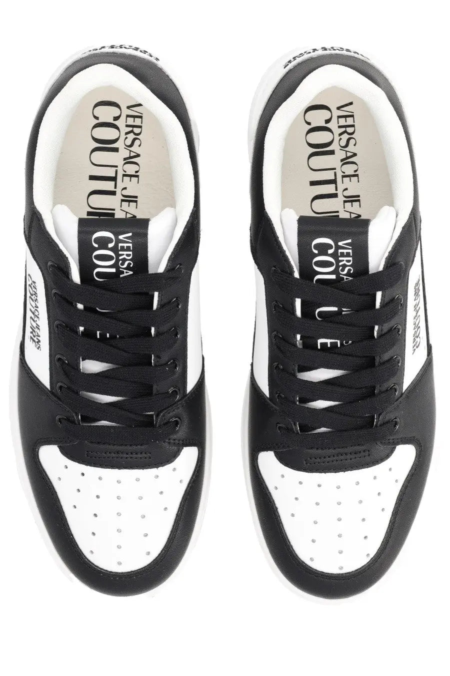 Versace Jeans Couture men’s Starlight sneaker in black and white with perforated toe panels and bold tongue branding