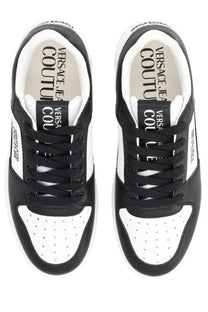 Versace Jeans Couture men’s Starlight sneaker in black and white with perforated toe panels and bold tongue branding