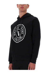 Versace Jeans Couture men’s black hoodie with bold white circular logo featuring the signature v and text
