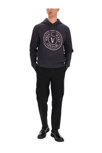 Versace jeans couture men’s sweatshirt grey in dark gray with a white circular logo featuring the brand v emblem