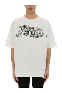 White oversized versace jeans couture t shirt with bold black logo and zebra stripe wave design for men