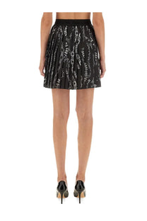 Versace Jeans Couture women’s black pleated mini skirt with bold white chain graphic print and text design