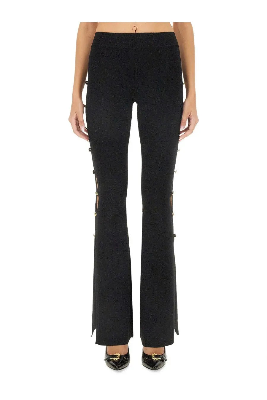 Versace jeans couture women’s black cut out pants with gold-tone buttons along outer seams and flared legs