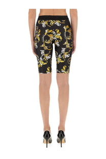 Versace jeans couture women’s black cycling shorts with bold gold and white baroque floral pattern