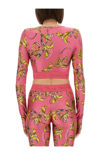 Versace jeans couture womens pink long-sleeved crop top and leggings set with yellow gold baroque pattern and logo waistband