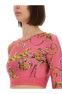 Versace jeans couture women’s pink long sleeve cropped top with bold gold cream baroque pattern and branded waistband