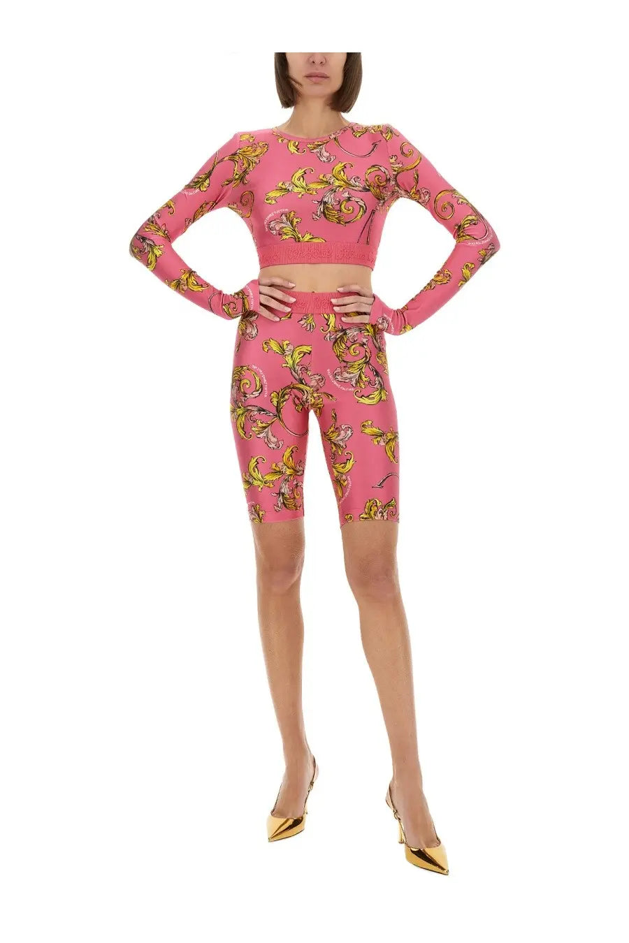 Versace Jeans Couture women’s pink long-sleeved crop top and biker shorts with yellow gold baroque pattern in knit fabric