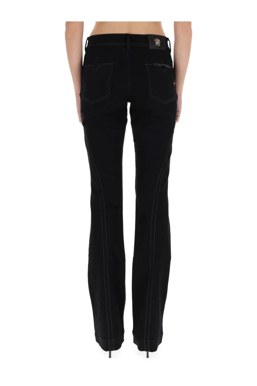 Black denim jeans for women with contrasting stitching and branded patch at waistband by versace jeans couture