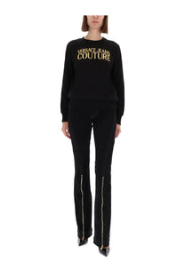 Black versace jeans couture women’s sweatshirt with gold lettering across the chest for stylish casual wear