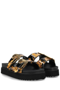 Versace Jeans Couture women’s black platform sandals with bold gold and black baroque pattern and ornate metallic buckles