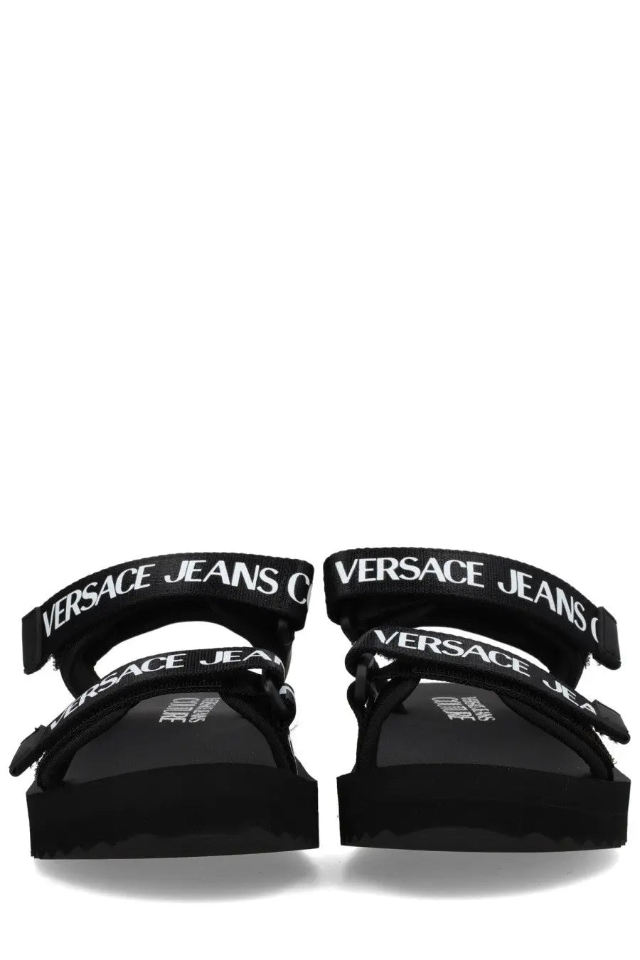 Versace Jeans Couture women’s black sandal with bold white logo straps and chunky platform sole