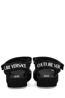 Versace Jeans Couture women’s black platform sandals with bold white couture versace lettering on straps