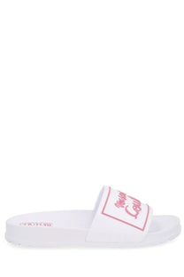 White versace jeans couture women’s slide sandal with pink juicy couture logo on strap