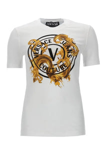 Versace jeans couture women’s white t-shirt featuring bold gold and black ornate logo design on front