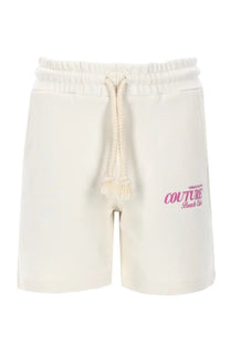 Versace Jeans Couture women’s cream cotton shorts with drawstring waistband and pink embroidery on left leg