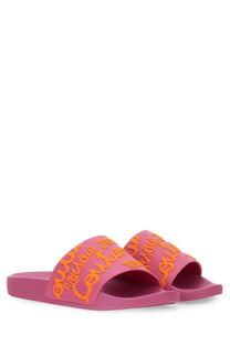 Versace jeans couture women’s pink rubber slide sandals with bold orange jeans lettering on the strap